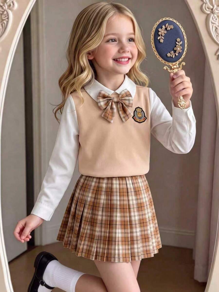 SHEIN Elladie kids 少女棕色格紋 2 合 1 英式學院風百褶裙套裝,翻領長袖內搭上衣 + 白色背心一體式設計,蝴蝶結,秋季 - 卡其色 - 查看 1