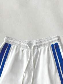 Manfinity Hypemode Conjunto de chaqueta y pantalones con bloques de color y patchwork para hombre - Azul y blanco - Ver 7
