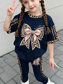 返校季 Y2K 美式復古豹紋粉色蝴蝶結印花 對比色運動條紋 少女簡約休閒短袖緊身褲兩件套 美式復古甜美休閒校園運動風 適合戶外野餐出遊街頭穿搭 - 彩色 - 查看 2
