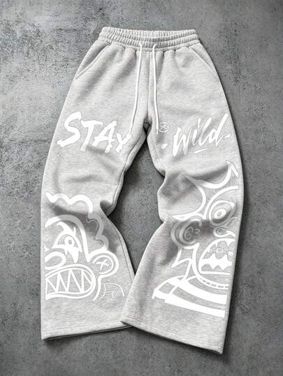 Manfinity EMRG Men's Charcoal Grey Wide Leg Sweatpants, Y2K Retro Streetwear Casual Long Pants, Graffiti Monster Abstract Face + Stay Wild Letter Print Gothic Style Loose Pants, Suitable For Coachella Music Festival, Club Party, Outing Gathering, Vacation Holiday, Concert Outfit