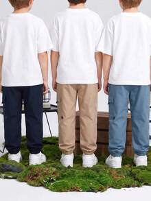 SHEIN 兒童青少年男孩休閒運動印花圖案貼布口袋寬鬆素色長褲，適合通勤、上學、日常、度假、旅行與運動 - 彩色 - 查看 3
