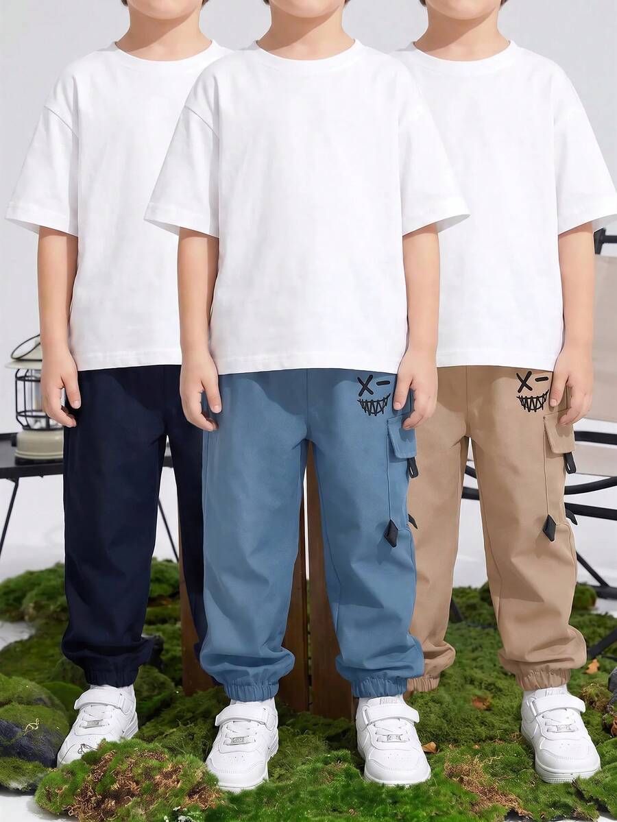 SHEIN 兒童青少年男孩休閒運動印花圖案貼布口袋寬鬆素色長褲，適合通勤、上學、日常、度假、旅行與運動