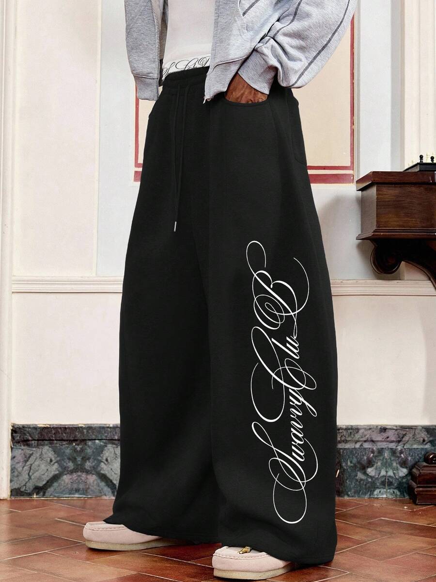 SWAVVY Men's Spring/Autumn Casual Loose Fit Long Sweatpants, Black, Standard Size, Elastic Double Waistband, Rubber Print - Black - View 1