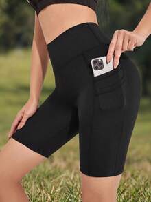 WanderVale Shorts elásticos sólidos con bolsillo para teléfono para ciclista - Negro - Ver 1