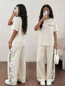 青少年女孩 T-shirt 套裝，黑色短袖 + 字母印花直筒寬腿褲，度假穿搭，夏季，六年級正式服裝，街頭風，休閒 - 黃色 - 查看 1