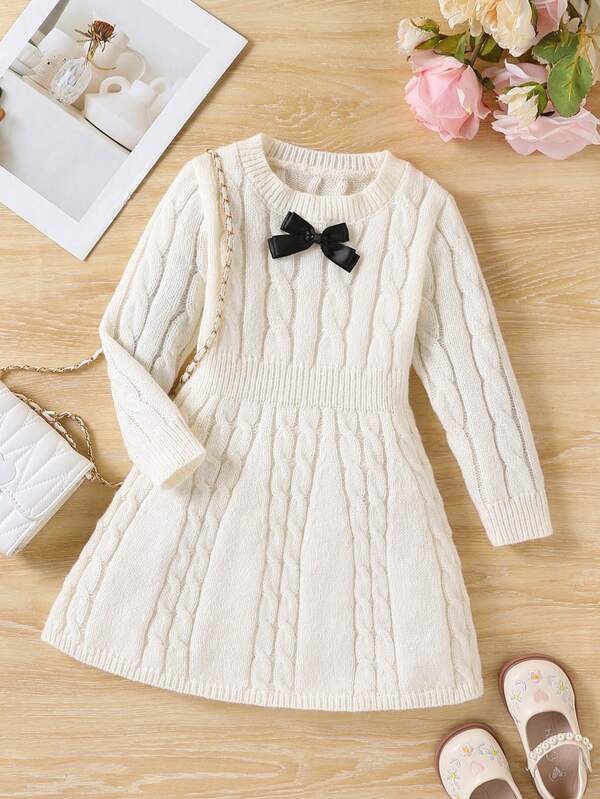 SHEIN 1pc Girls' Sweater Dress, Versatile Round Neck Cable Knit Texture White Cinched Waist Long Sleeve A-Line Skirt, Black 3D Bow Decor, Cute Style, Regular Thickness, Neat Hem, Tight Cuffs, Fine Craftsmanship, Delicate Texture, Suitable For Wearing Alone, Daily Wear, Outings, Home, School, Outdoor Activities And More Occasions, Autumn/Winter Outfit