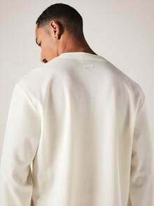 PLAYBOY X SUMWON Bunny Embroidered Waffle Knit Henley Long Sleeve Boxy Top With Button Placket Neckline - Beige - View 5
