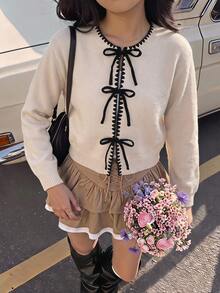 SHEIN 兒童青少年女孩黑色對比飾邊蝴蝶結綁帶素色杏色圓領長袖寬鬆針織開襟衫，適合秋冬返校學院風 - 杏色 - 查看 2