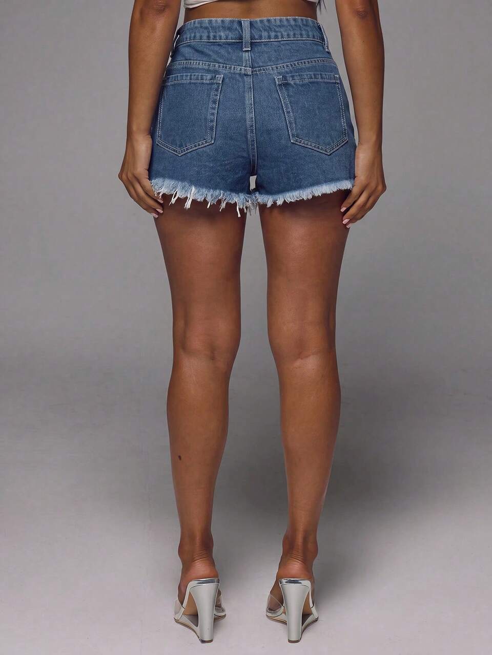 Distressed Hem Mid Rise Light Wash Denim Shorts