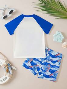 SHEIN X The Smurfs Young Boy Cartoon Print Round Neck Short Sleeve Top And Shorts 2-Piece Swimsuit Set, Suitable For Summer Vacation - Blue - View 2