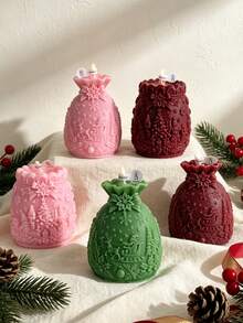 Christmas Embossed Gift Bag With Aromatherapy Candles Featuring Christmas Tree, Elf, Gift, Sleigh, Reindeer, And Snowflake Embossments. Available In 3 Colors: Pink, Green, And Burgundy - Christmas gift bag - View 1