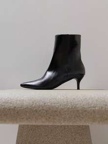Nöista Pointed Toe Ankle Boot With A Clean Silhouette, Slim Mid Heel, Smooth Leather Finish And Inside Zip Closure. Fall Boots - Black - View 1