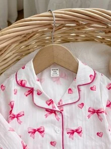 SHEIN Conjunto de pijama para niña bebé con estampado de lazos, ribete de contraste y volantes - Blanco - Ver 9
