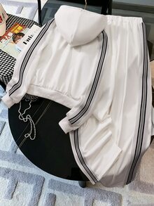 SHEIN 女童寬鬆連帽落肩條紋長袖上衣 + 側條紋直筒休閒褲套裝，極簡清新風格，柔軟舒適面料，適合日常上學、戶外運動、購物與旅行，寬鬆版型活動自在，休閒穿搭 - 白色 - 查看 2