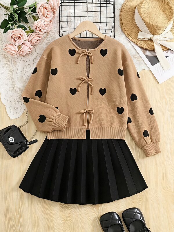 SHEIN Tween Girl Tween Girl Loose Casual Minimalist Comfortable Round Neck Long Sleeve Tie Bow Front Cardigan + Black Knitted Pleated Skirt 2 Pieces Set, Suitable For Fashionable Streetwear And Back To School Outfits