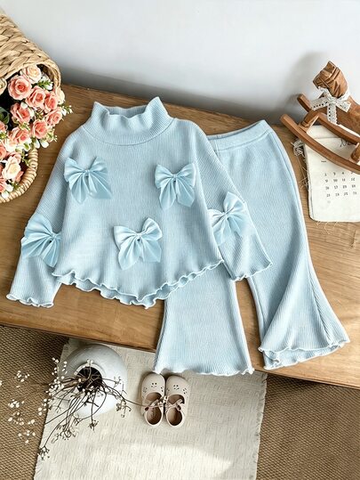 SHEIN Playful Pals طقم علوي وبنطال محبوك بلون المشمش مع ياقة واقفة وأكمام طويلة وأكمام خفاشية مزينة بفيونكة، بأسلوب الأخت الجارة اللطيفة، ملابس خريفية/شتوية حلوة وجميلة وأنيقة للرضع والبنات الصغيرات