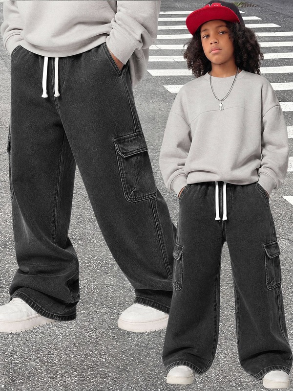 SHEIN Vacaura Tween Boy Cargo Straight Leg Pants, All-Season New Casual Minimalist Versatile Style With Large Side Cargo Pockets, White Drawstring Elastic Waist, Streetwear Black Grey Washed Cargo Wide Leg Denim Straight Pants, Pairs Well With Sweatshirts, T-Shirts, Sneakers, Suitable For Daily Wear And Vacation