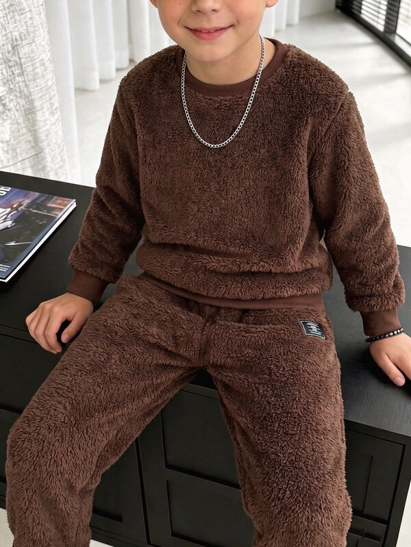 SHEIN Boys' Warm Coffee Plush Sweatshirt 2 Pieces Set, Soft And Cozy For Autumn/Winter. Crew Neck Sweatshirt With Ribbed Cuffs, Loose Fit Without Tightness; Paired With Matching Fabric Jogger Pants, Easy To Wear Without Matching, Soft And Skin-Friendly Touch, Comfortable For Daily Indoor Wear.