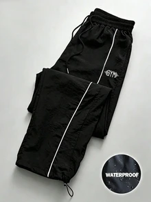 Coreblaze Celana Panjang Olahraga Pria Longgar dengan Motif Huruf dan Tali Serut di Pinggang, untuk Gym - Hitam - View 1
