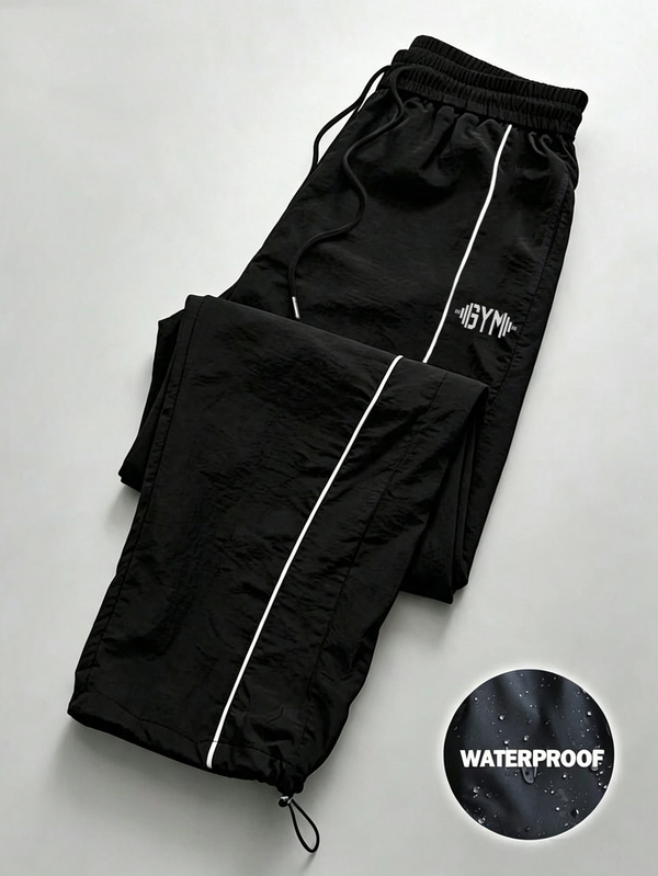 Coreblaze Pantalones largos deportivos de corte holgado con cintura de cordón y estampado de letras para hombre
