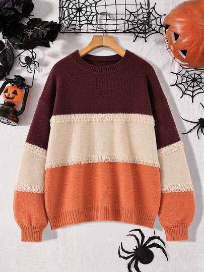 GlowEve CURVE Suéter de cuello redondo con bloques de color de Halloween, talla grande para mujeres. Pullover casual de otoño e invierno con detalles de borlas. Combinación de colores llamativa