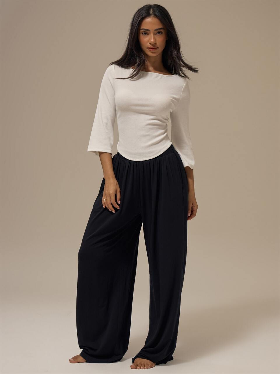 White Fine Ribbed Knit Boat Neckline Curved Dip Hem Three Quarter Flare Sleeve Slim Fitted Top