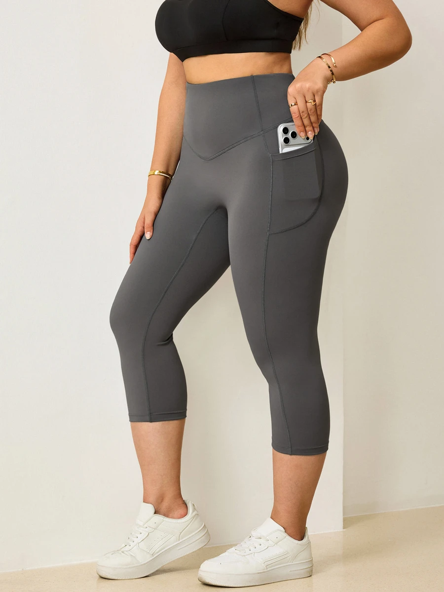 Easithlete Women's Plus Size Solid Color Caprileggings With Pockets - Dark Grey - View 1