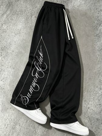 Pantalones holgados ajustables con cremallera de metal y estampado gráfico para hombre