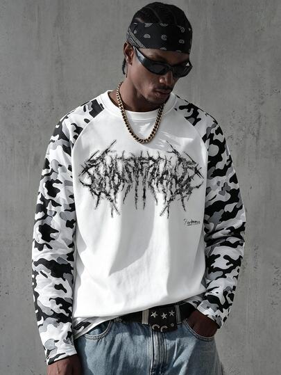 Manfinity EMRG Men's Raglan Long Sleeve T-Shirt, White Body, Black White Grey Camo Print Sleeves, Distressed Dark Gothic Metal Font Print, Streetwear Style