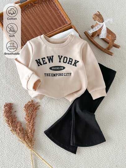 SHEIN Baby Girl 0-3y Spring/Autumn Apricot Letter Print Long Sleeve Top And Black Flared Pants 2-Piece Set, Cute Comfortable Minimalist Style, Suitable For Indoor And Outdoor Activities