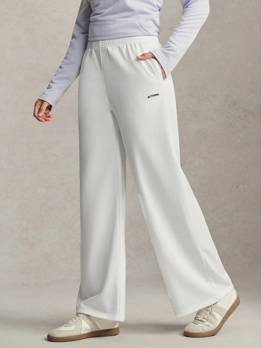 Activina Women's Summer Spring Elegant Stylish White Wide Leg Sports Pants With Elastic Waistband And Pockets Design With Logo Detail