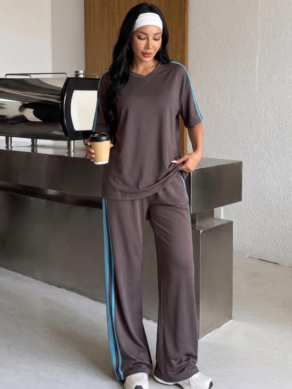Muchica Conjunto deportivo de camiseta a rayas con bloques de color y pantalones largos para mujer