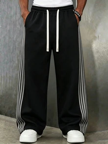 Manfinity Roghcode 年輕男性街頭風多功能單品：寬鬆休閒側邊緞帶設計鬆緊腰運動長褲，適合街頭風、日常休閒穿搭、週末出遊、音樂節、社交聚會等年輕社交場合，男士衣櫥不可或缺的百搭單品，送給男友或丈夫的絕佳禮物，寬腿版型 - 黑色 - 查看 3