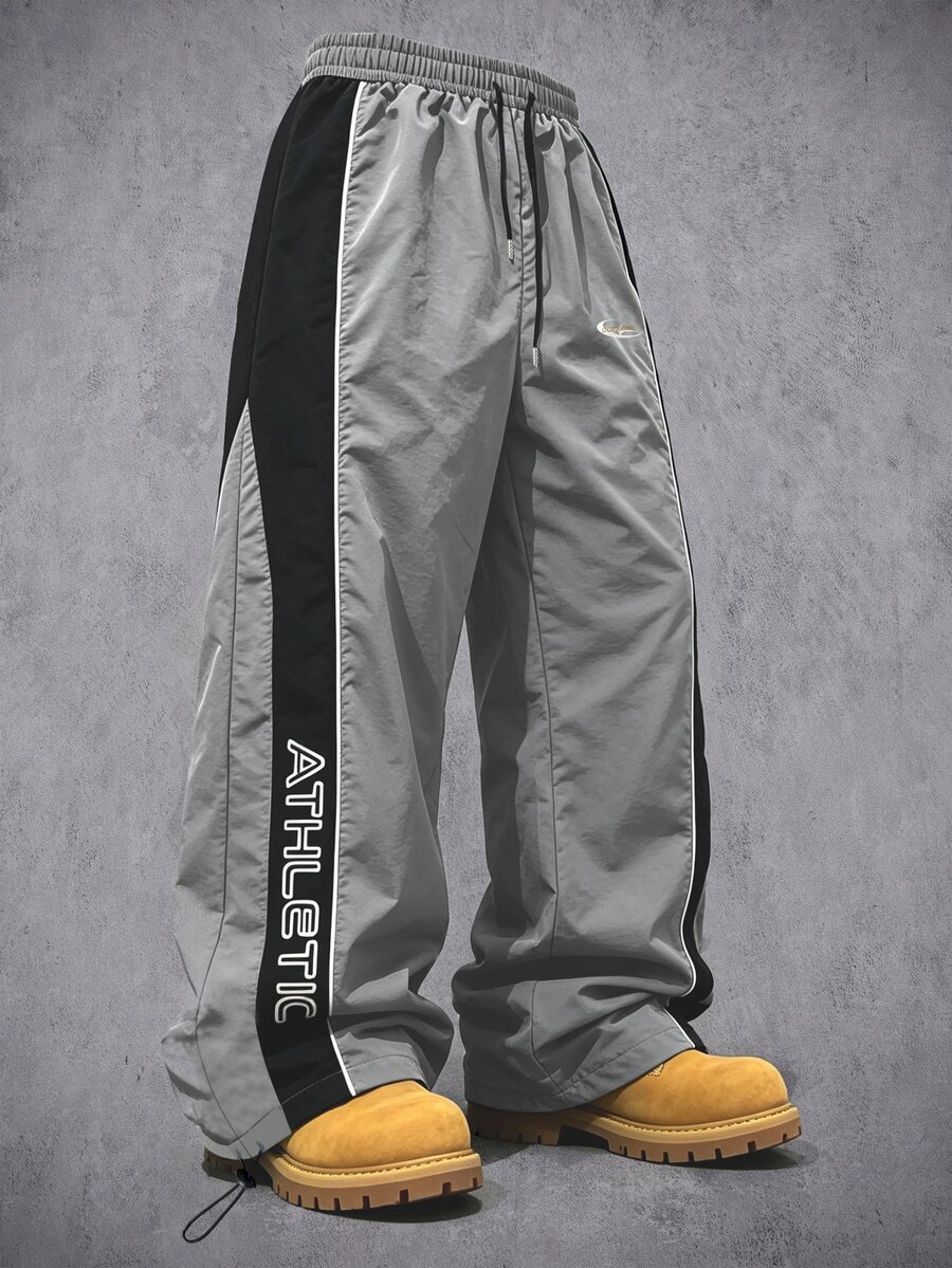 Manfinity Denimwave Men Loose Fit Track Pants Nylon Fabric Quick Dry Contrast Side Strip Letter Print Drawstring Waist Adjustable Hem Windbreaker Jogger Street Trousers - Grey - View 1