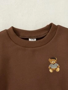 SHEIN طقم ملابس للأولاد الرضع من 0-3 سنوات بأسلوب فرنسي جديد، قطعتان بلون بني، سويتشيرت برقبة دائرية مع نمط دب وبنطال مخطط، مناسب للخروجات والمدرسة والمناسبات الأخرى - بني - مشاهدة 5