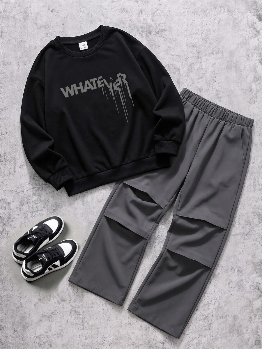 青少年男孩休閒兩件套服裝,黑色圓領圖案衛衣 + 灰色寬腿工裝褲,衛衣胸前滴落字母印花、羅紋袖口,褲子彈性腰頭、直筒版型,簡約時尚 - 彩色 - 查看 1