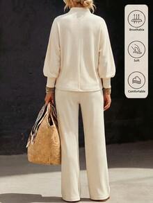 Zayélia Off-White Ribbed Lounge Set. Button Split-Neck Top With Balloon Sleeves Matched With Relaxed Wide-Leg Trousers. - Multicolor - View 2