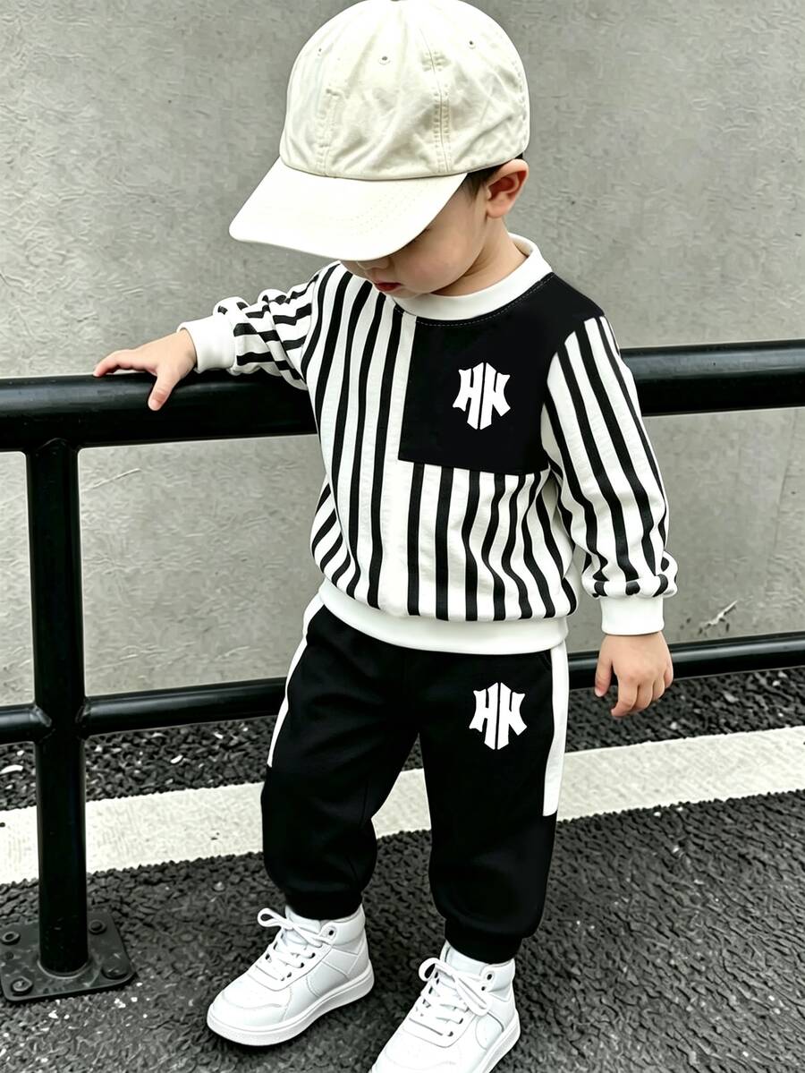 1套嬰兒幼兒運動風衛衣套裝，黑白垂直條紋拼接拼色印花，胸前與褲子字母Logo圖案，圓領長袖落肩袖，薄款嬰兒衛衣與長褲2件套，適合戶外旅行、上學、日常散步，春秋季男嬰時尚運動套裝 - 彩色 - 查看 1