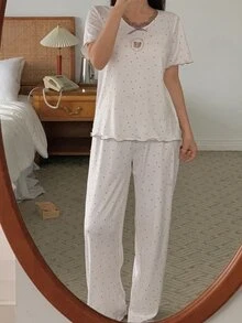 DAZY Bộ đồ ngủ nữ 2 món áo cổ tròn tay ngắn họa tiết chấm bi đính nơ và quần - trắng - Xem 10