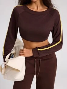 Dewbera Dewbera بلوزة رياضية نسائية بياقة دائرية وأكمام طويلة بألوان صفراء وبنية بتصميم كتل لونية قصيرة ومحكمة - بني - مشاهدة 1