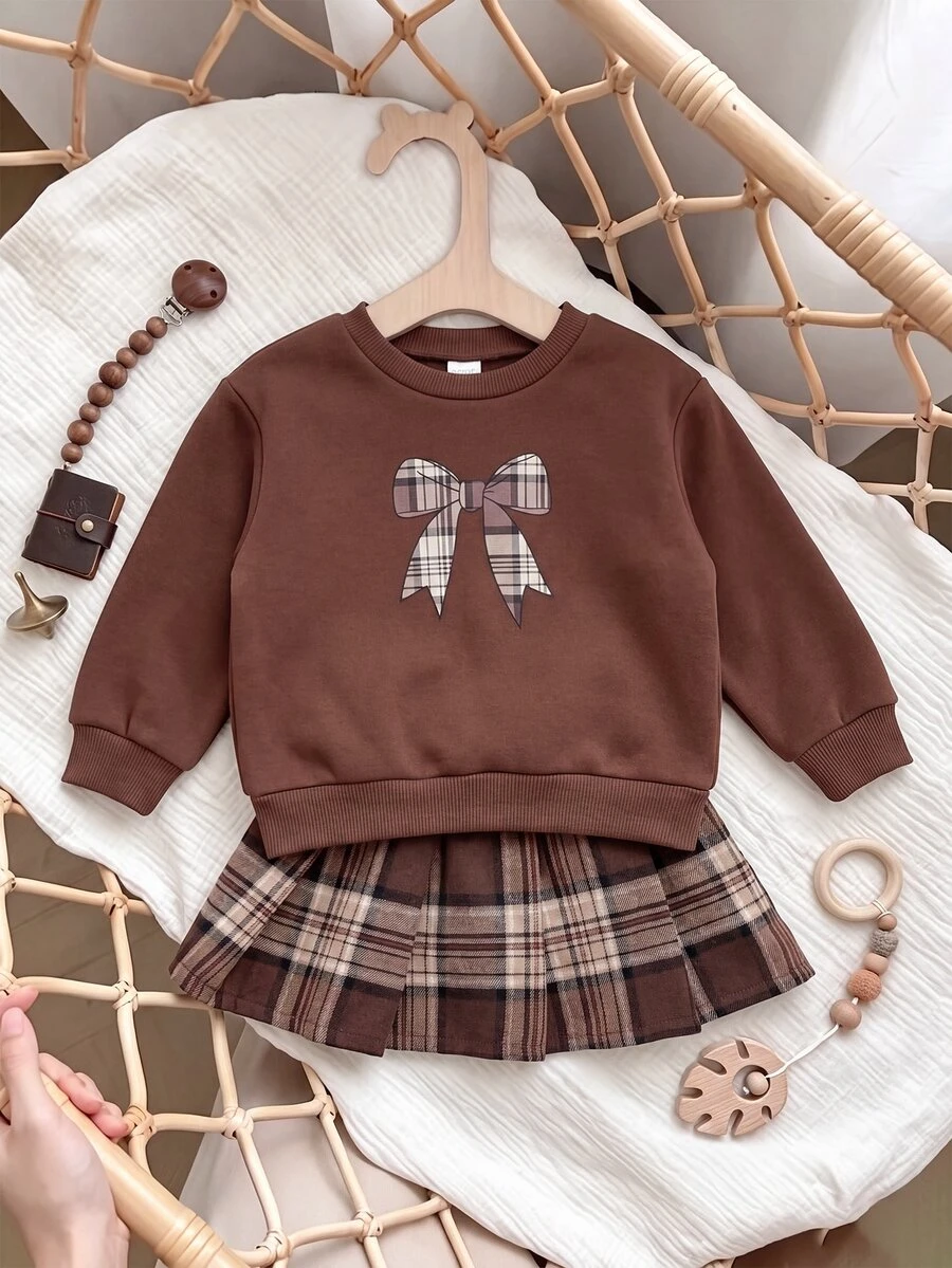 SHEIN Baby Girl Fleece Thick Decorative Bow Plaid Print Pattern Crew Neck Pullover Sweatshirt & Vintage Plaid Pleated Skirt Set, Suitable For Winter - Brown - View 1