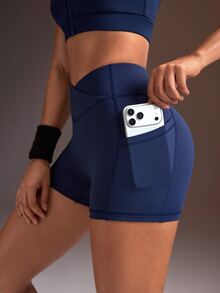 Powerista Women's Minimalist Solid Color V-Waist High-Waisted Side Pocket Athletic Shorts - Navy Blue - View 3