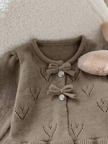 SHEIN Gentle Style Baby Girl Hollow Heart Jacquard Knit Set, Bow Knot Button Cardigan, Frill Trim Sweater, Flare Pants, 2 Pieces Set - Camel - View 7