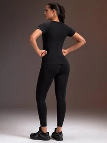 Powerista طقم رياضي نسائي بدون درزات بقصة ضيقة، توب بأكمام قصيرة + بنطال ليقنز ضيق بطول الكاحل - الأسود - مشاهدة 6