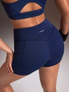 Powerista Women's Minimalist Solid Color V-Waist High-Waisted Side Pocket Athletic Shorts - Navy Blue - View 5