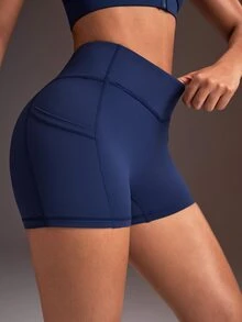 Powerista Women's Minimalist Solid Color V-Waist High-Waisted Side Pocket Athletic Shorts - Navy Blue - View 1
