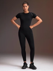Powerista طقم رياضي نسائي بدون درزات بقصة ضيقة، توب بأكمام قصيرة + بنطال ليقنز ضيق بطول الكاحل - الأسود - مشاهدة 1