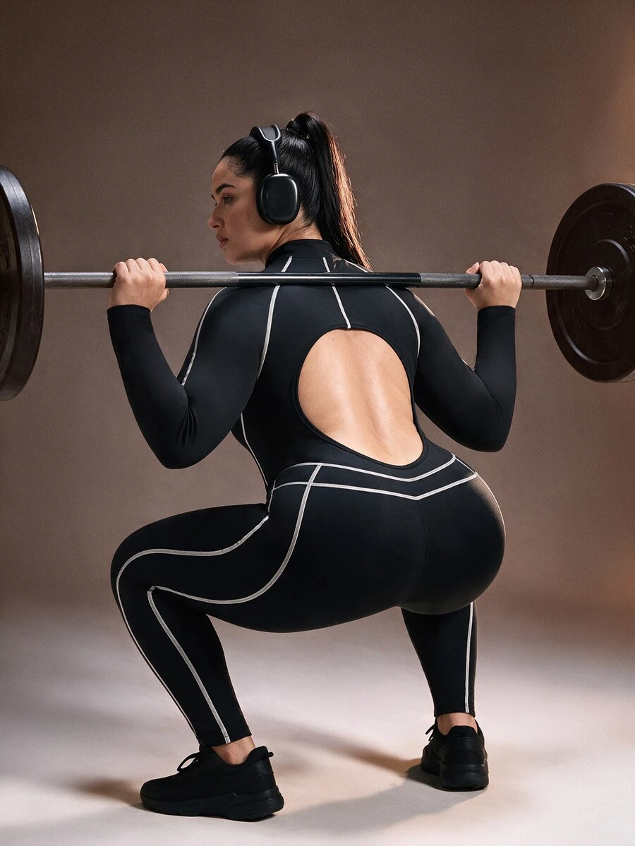 Powerista Plus Size Women's Form-Fitting Sports Jumpsuit With Mock Neck And Back Cutout Detail Ideal For Intense Workouts Athletic Jumpsuit Half-Placket Design - Black - View 1