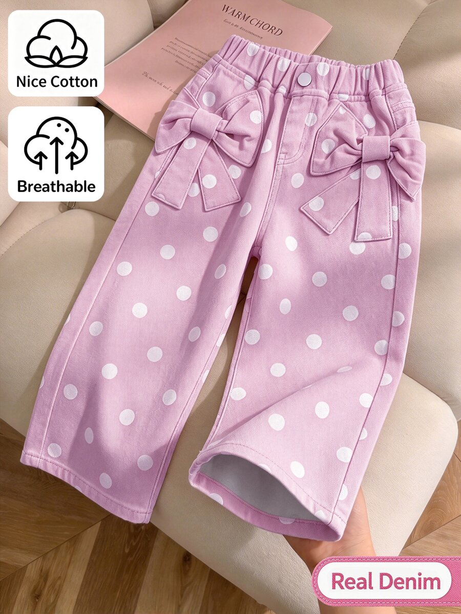 SHEIN Genkimix Kids 女童牛仔長褲,四季皆宜,柔軟棉質,休閒時尚,百搭舒適,極簡甜美可愛,彈性腰頭,兩側蝴蝶結貼花設計,黑色波點與杏色印花布料,寬鬆直筒版型,杏色水洗軟牛仔,適合日常穿著與度假 - 彩色 - 查看 1