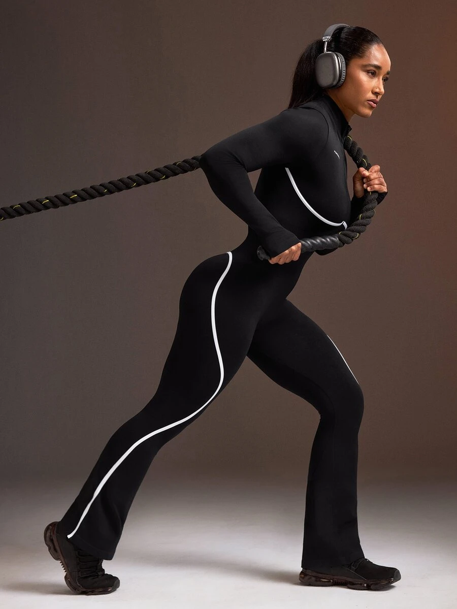 Powerista Women's Half-Zip Long Sleeve Sports Jumpsuit - Black - View 1